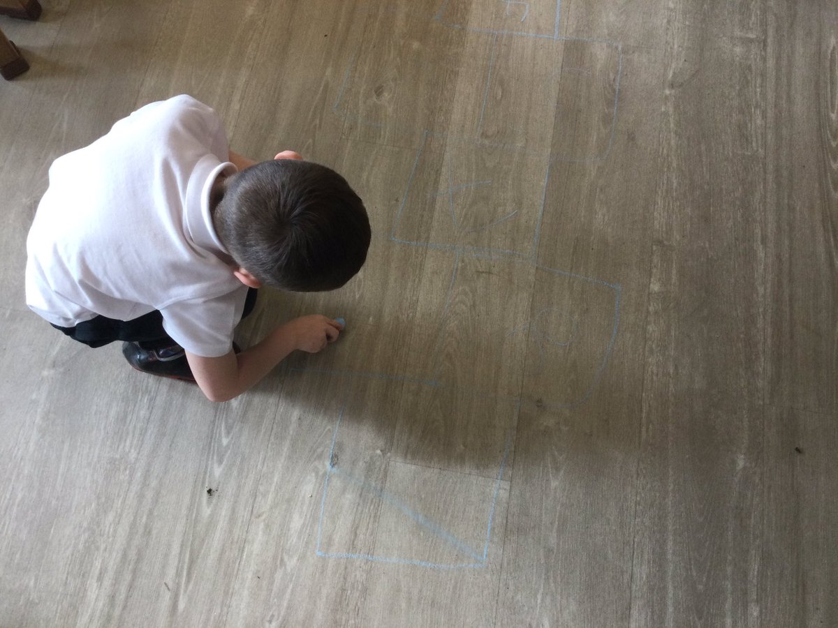 F made a hopscotch board in the nursery. He wrote all the numbers by himself, then tried it out. Great coordination skills. #earlynumeracy