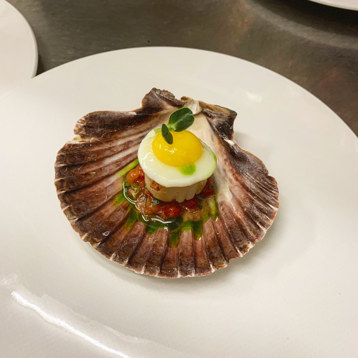 Scallop/sauce vierge/quail egg/ taragon oil.