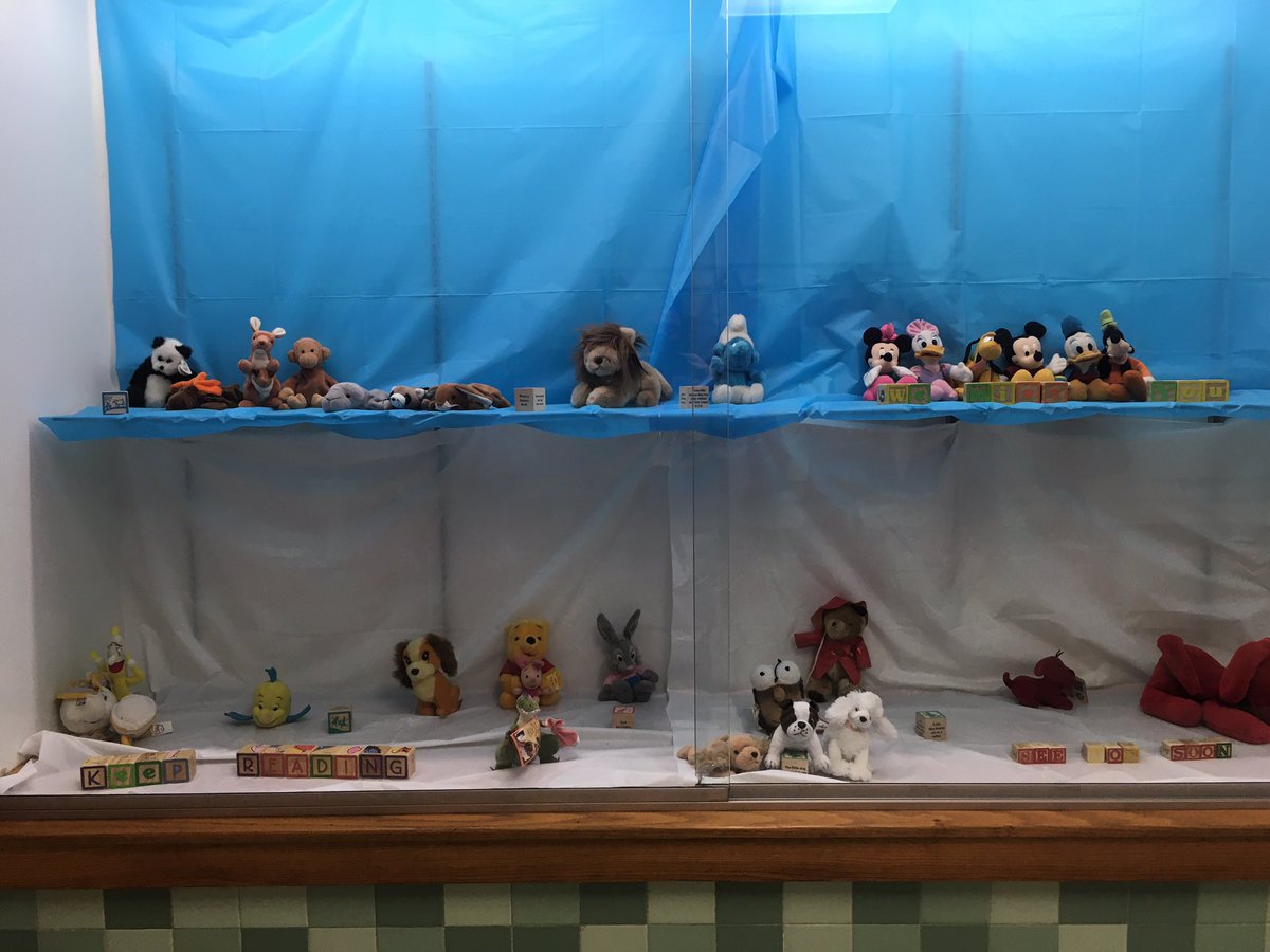 Thanks to Mrs. Geveci for getting books into hands of students, but some library friends (thanks to Mrs. Carnevale) have a message for students- look close in the picture!