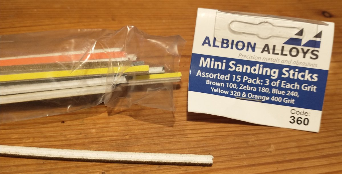 Doin' sandin'. Last time I did this, it didn't go well as 1:72nd model plus ginormous sanding block was not an optimal match. Now I have tinky lickle sanding sticks, which work really well. "Makes it so smoooove!""Certainly removing all the surface detail...""So smoooove..."