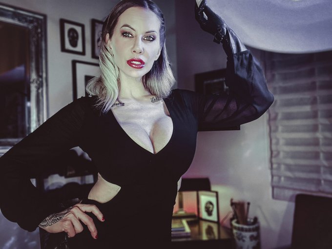 Performing a little snip snip in my living room while wearing an evening gown. Wanna see my blade? Get