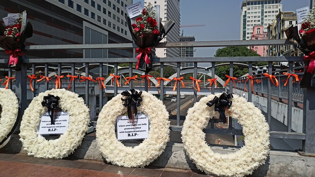 Myanmar_Now_Eng's tweet photo. People placed memorial wreaths, flowers and ribbons for those who were killed during the anti-coup protests, at Sule in Yangon on Saturday. #WhatsHappeningInMyanmar https://t.co/7qWRpFOoGg