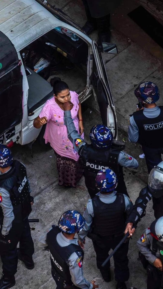 HNwayoo's tweet photo. The police can be seen pointing guns at medical covers and physically hurting a pregnant woman.This is the solid proof that they’re just animals who have no basic ethic and humanity.Please take action of this inhumane act.@freya_cole @KenRoth  #Feb27Coup
#WhatsHappeningInMyanmar https://t.co/n5GtWsg2PI