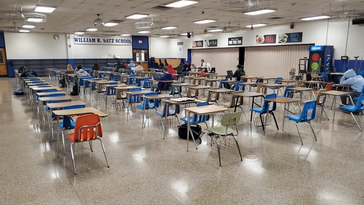 Here's the lunch room seating that, in one week, is supposed to work for kids to be masks-off eating. (In case you weren't sure, those desks are not six feet long.)

Yes, vaccines are starting to be available. No, the Ts (nor parents nor Ss) have not gotten them yet.