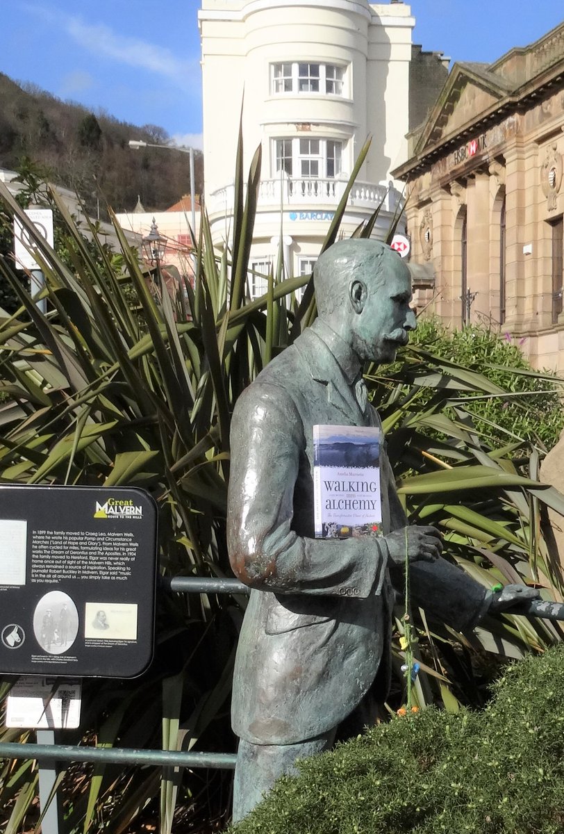 Writing_Austria's tweet photo. Elgar is holding my book; I do hope that my boy Gustav Holst is not going to get jealous! #malvern #malvernhills #LockdownBooks #walkingintoalchemy #mybookintheworld #naturecure #wanderers #wayfares #walking @HolstMuseum @Benslow_Music @NTTheFirs https://t.co/BBwzg33tBO