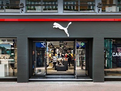 Puma outlet. Пума магазин. Магазин Пума витрина. Puma витрина магазина. Пума магазин в Лос Анджелесе.