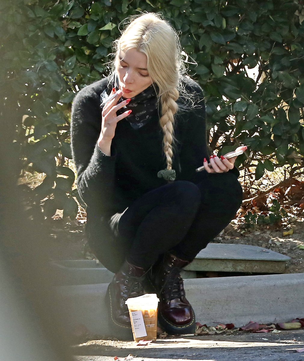 dakota johnson and anya taylor joy smoking on the sidewalk.… yeah