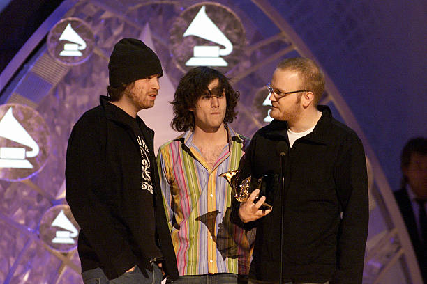 coldplaying's tweet photo. On this day, 19 years ago, Coldplay were awarded 'Best Alternative Album' at the 2002 Grammys for their debut 'Parachutes'🏆

The band would go on to win over 200 more awards throughout their career and greatly improve their fashion sense!

🔗https://t.co/zA1G7TaJYH https://t.co/QXW0fokRNV