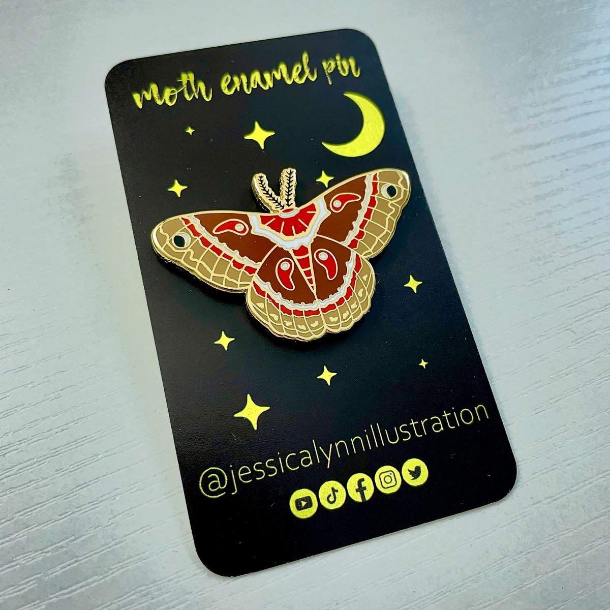 ✨Here is my moth enamel pin on it's backing card with gold foil accents!! 😍 Available in my shop on March 1st🌙 etsy.com/shop/JessicaLy… ✨ #shopupdate #enamelpin #pincollector #pincollection #pincommunity #pinaddict #pinsforsale #hardenamelpin #pincollecting #enamelpinsforsale