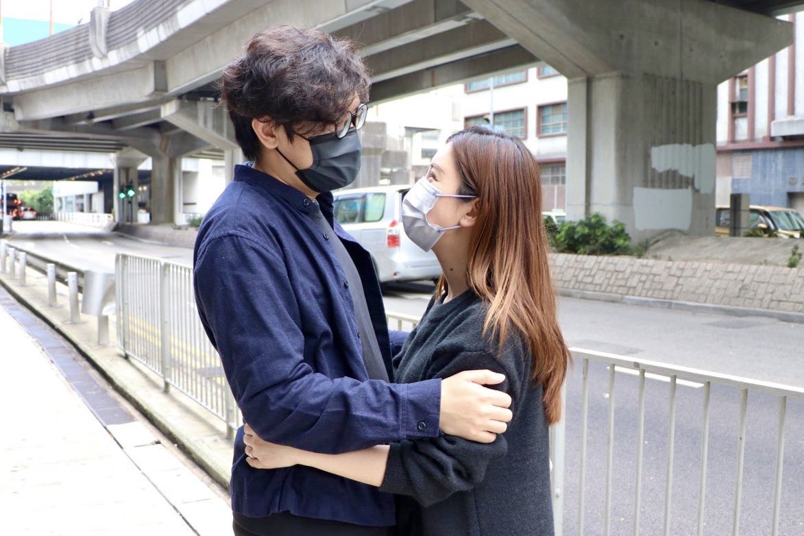 JessiePang0125's tweet photo. Pro-democracy activist @samcheunghosum hugs his wife as he reporting to the police station over #nationalsecuritylaw charges in Hong Kong. https://t.co/zgvrcr9hmK