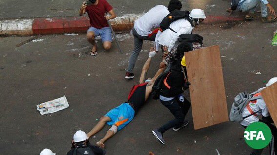 Yangon. Another protester shot by gunfire. At least 5 were shot, &amp; 2 are in critical conditions. SPRING REVOLUTION #WhatsHappeningInMyanmar #OpCCP #Feb28Coup #MilkTeaAlliance