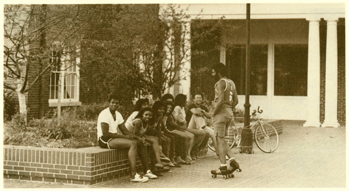 #SundayStyle brought to you by the #OHIOUniversityArchives Fashion Pinterest board. This group of #1980s @ohiou students sits in front of Irvine Hall on West Green. See more Bobcat fashion at bit.ly/fashpins