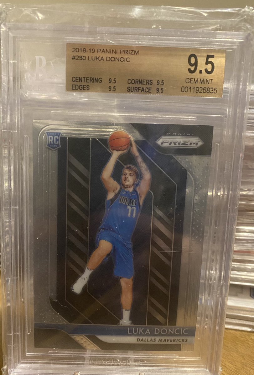 SlabTrader's tweet photo. Will we be giving away this #lukadoncic #rookie at 10k followers & #ronaldacunajr #rookie at 5k followers. Spread the word and give us a follow. #thehobby #Topps #prizm #sportscards #bowmanchrome #PSA #BGS 🏠📦🔁📦🏠 #slabtrader goes live 3/5/21 trade with collectors everywhere https://t.co/v2g9VsddXp