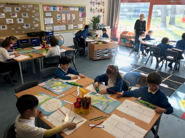 BSNJSV's tweet image. #JSVY2 using atlases to explore continents. Which continent were you born on?