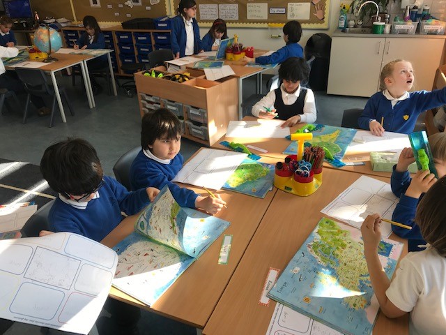 BSNJSV's tweet image. #JSVY2 using atlases to explore continents. Which continent were you born on?