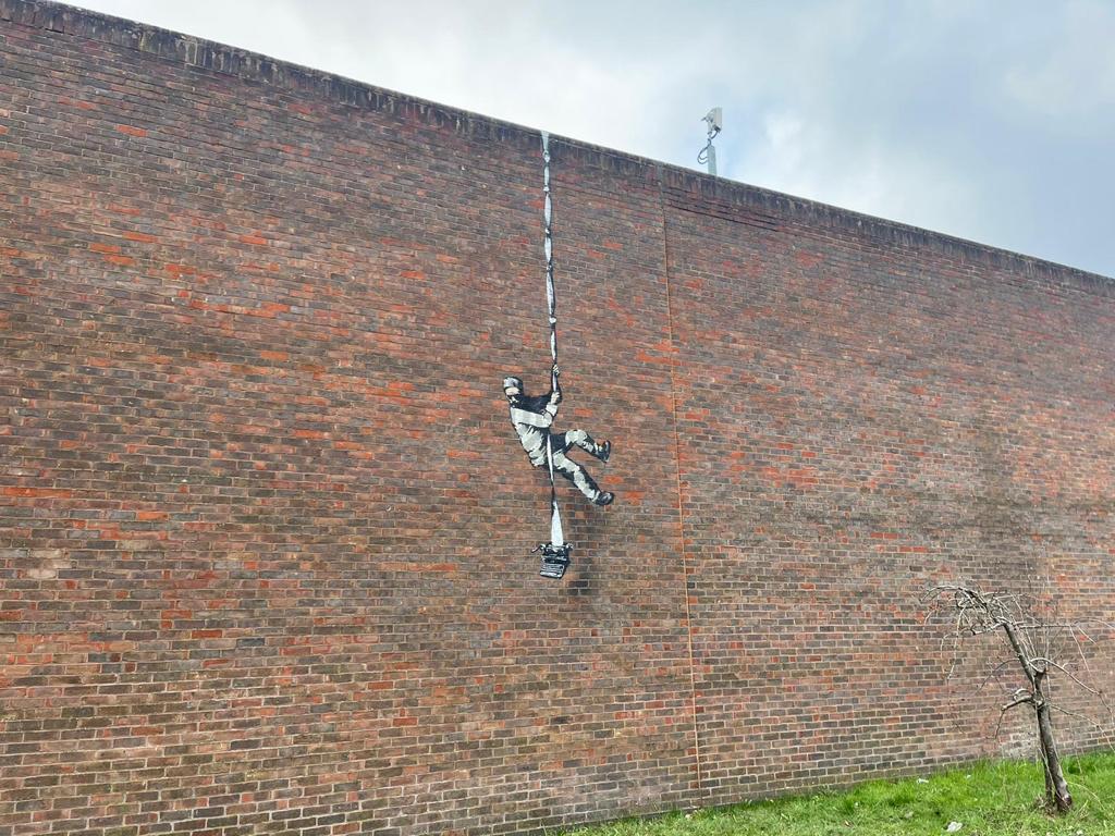 Do we have a genuine Banksy in #rdguk? This artwork appeared on the side of Reading Gaol overnight. We've yet to have any sort of confirmation or denial from Banksy yet, but what do you reckon? Is this the real thing??