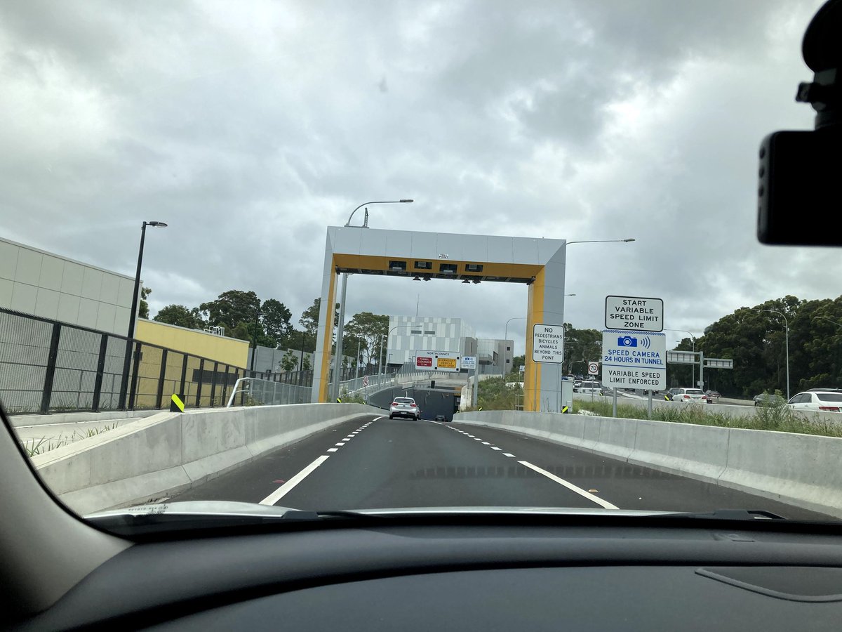 unraveaero's tweet photo. The gantry in the pic is a "toll booth" at the entry of Sydney's latest toll road. When you pass under it reads a small device in your car and the toll amt is debited from your a/c. You don't have to queue up to pay tolls. https://t.co/DCQGrKe9oy