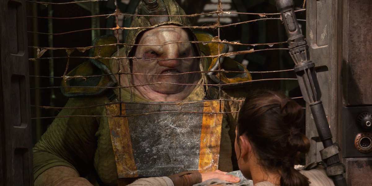 Rey brings her wares to the most despicable man in Jakku: Simon Pegg.That's Unkar Plutt, mean-spirited junk boss of Niima Outpost. He's known Rey since she was abandoned in the world and has used her skills over and over again.