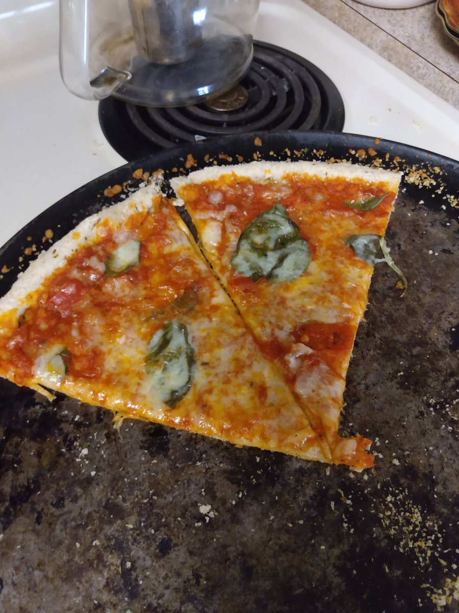 BearCraft88's tweet photo. My homemade pizza keeps getting better and better. Removed oil from the dough and the crust is nice and bendy like a pizza crust should be. Hand stretched and finger pressed pizza, topped with fresh basil. 
#pizza #homemade #homemadepizza #freshbasil #tasty #fromscratch #Italian https://t.co/RnKqOcUbab