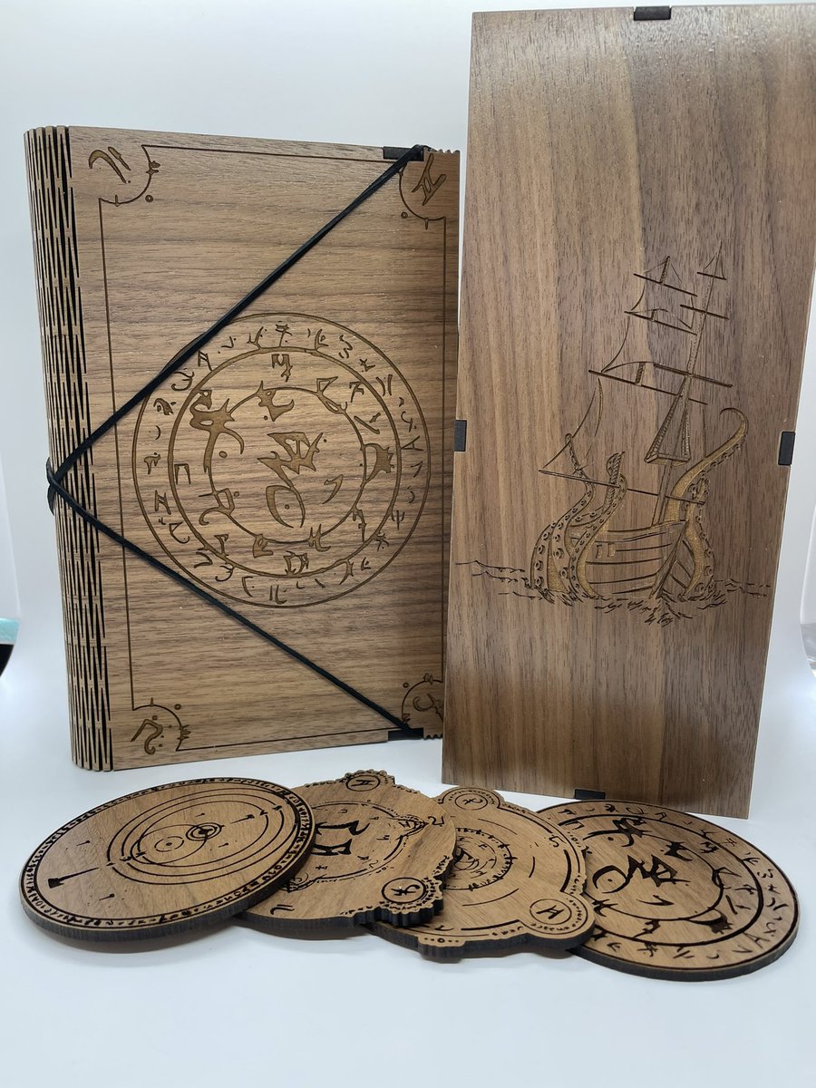 A matched set of walnut accessories including a spellbook dice tray, Kraken’s Lair dice tower and some spell rune coasters that were shipped out recently. #ttrpg #dnd #dicetray #dicetower #coasters