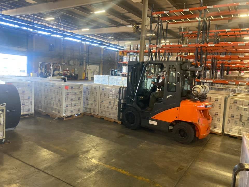 Texas A&M Forest Service employees assist at a water distribution site in Fort Worth on February 24, 2021.