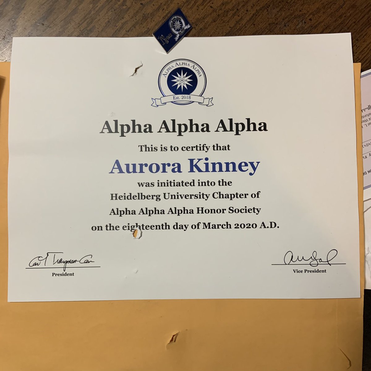 fiberlazygamer's tweet photo. I finally got my Tri-Alpha certificate and pin!!! It has some holes in it I think from the pin, but I’m just glad it’s here! https://t.co/NkUhOkUWEF