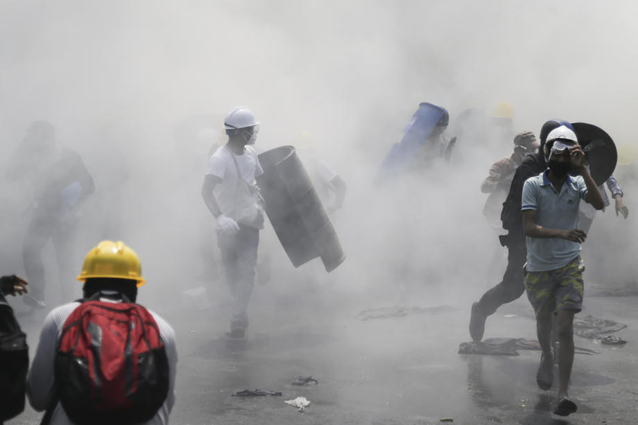 Demonstrators flee from tear gas launched by security forces during a protest against the #militarycoup in #Yangon, #Myanmar, 02 March 2021. EPA-EFE/LYNN BO BO