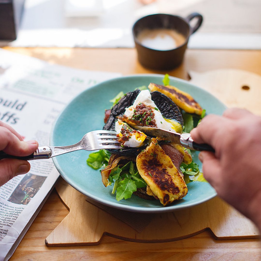 THE BREAKFAST CLUB - Poached egg sitting on halloumi, grilled mushroom, bacon, avo and rocket. Served on a slice of toasted sourdough and topped with Taberu Rayu.
Order this delicious meal and we will treat you to a flat white coffee on the house  (valid for the month of March)