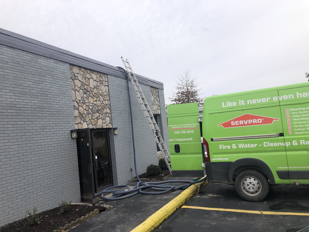 SERVPROofWV9835's tweet photo. We couldn't be scared of heights yesterday! Crew Leader Travis was busy extracting water from the roof of a local business that was largely affected by the recent downpour. #waterextraction #floods #SERVPROstrong https://t.co/9KUrrnT785