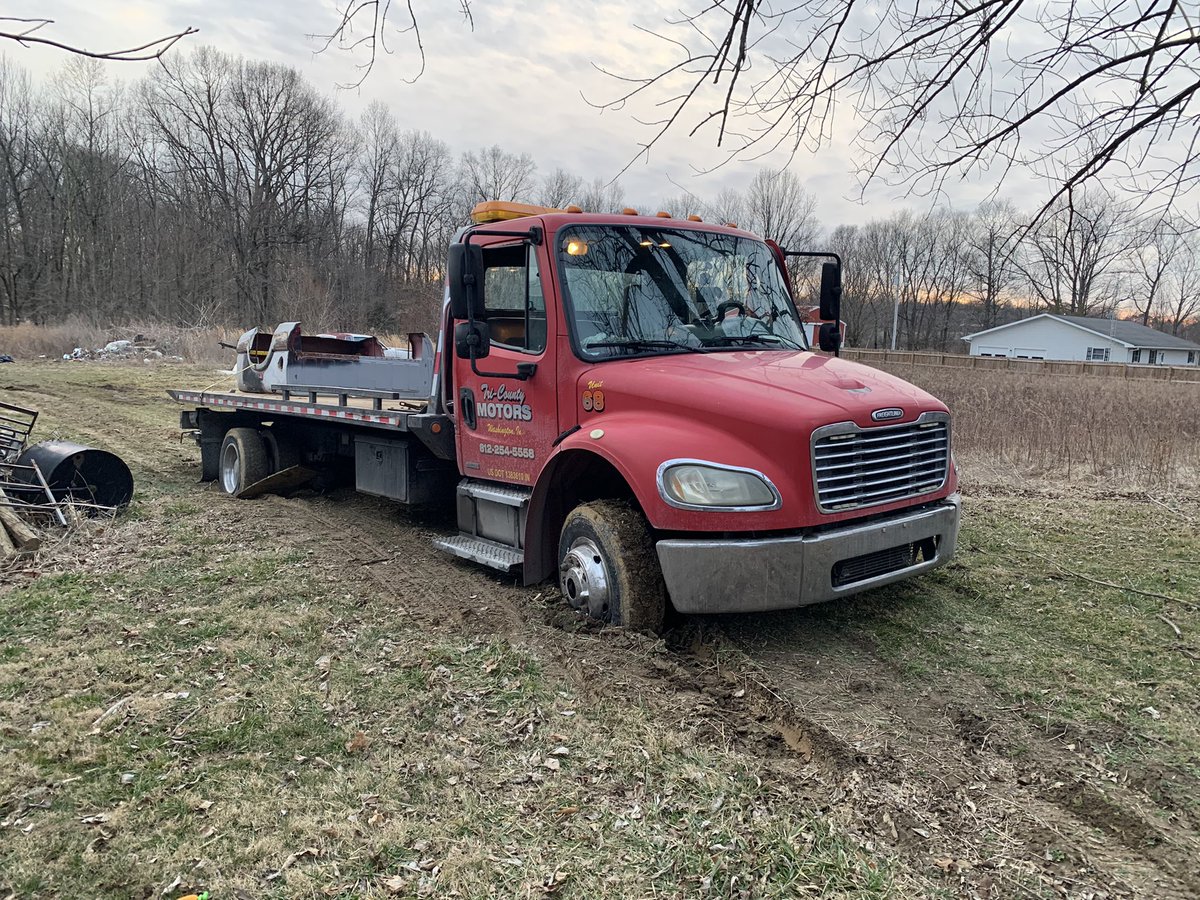 MotorsportsTC's tweet photo. Little wet while helping out a buddy to transport a low rider s10. #freightliner #towing #towingandrecovery https://t.co/KNG5ZzZ60x