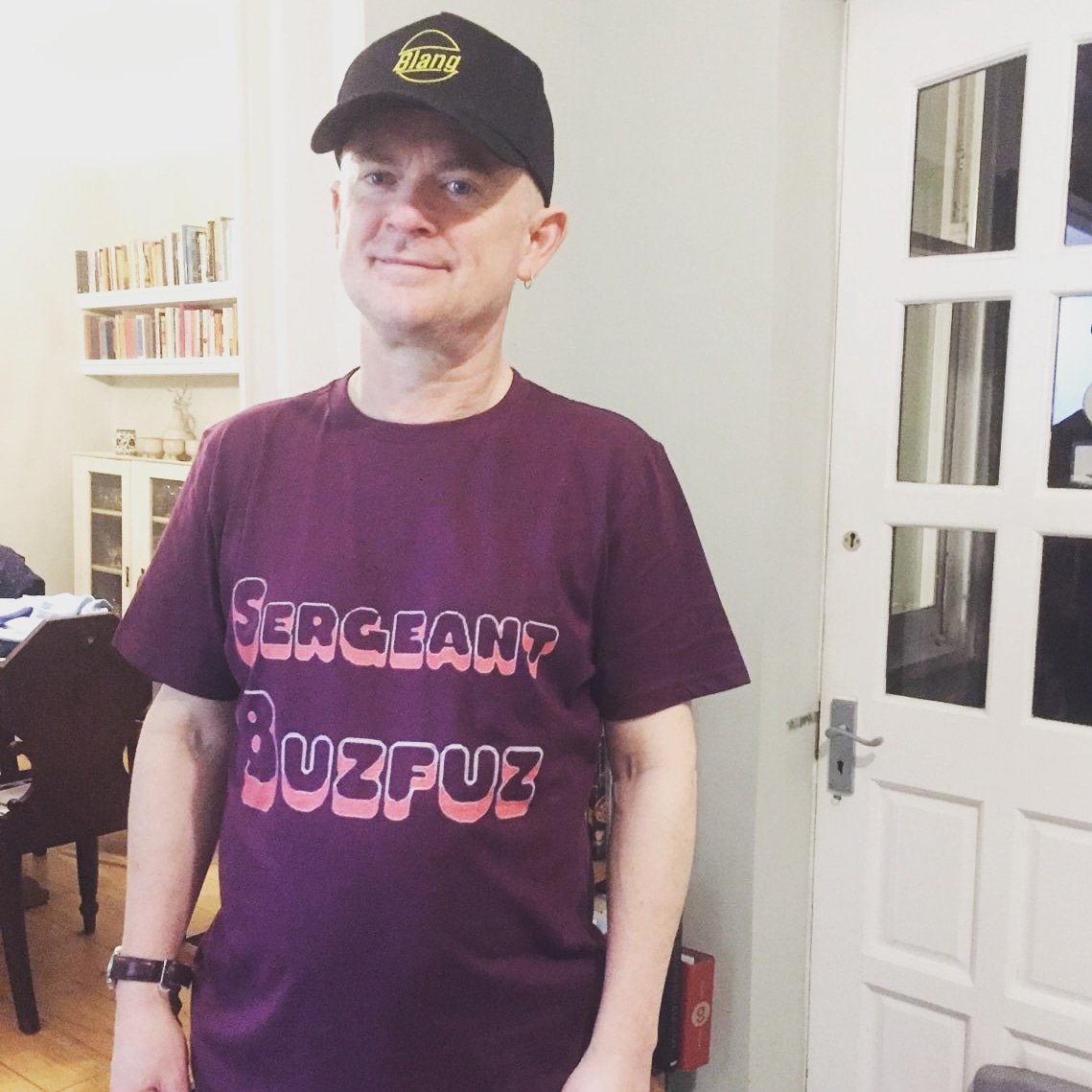 Joe putting the 'Fox' into 'Fox Pop' in his new Sergeant <a href="/Buzfuz/">Joe Murphy</a> garms!

This fabulous attire is made from organic cotton &amp; printed in the UK in a factory run by renewable energy.

Tees available in mens XS-XXL + 8-18 womens + long sleeved tops for kids.

Get the look by...