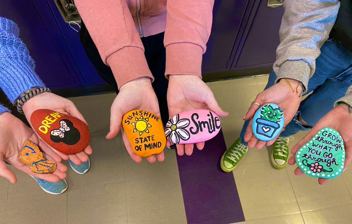 Hmmmm . . . I wonder where these @happyrocksby happy rocks will end up today! Mikayler is bringing lots of joy to some special people here at NHS 💜#happyrocksbymp #KindnessMatters #LancerPride