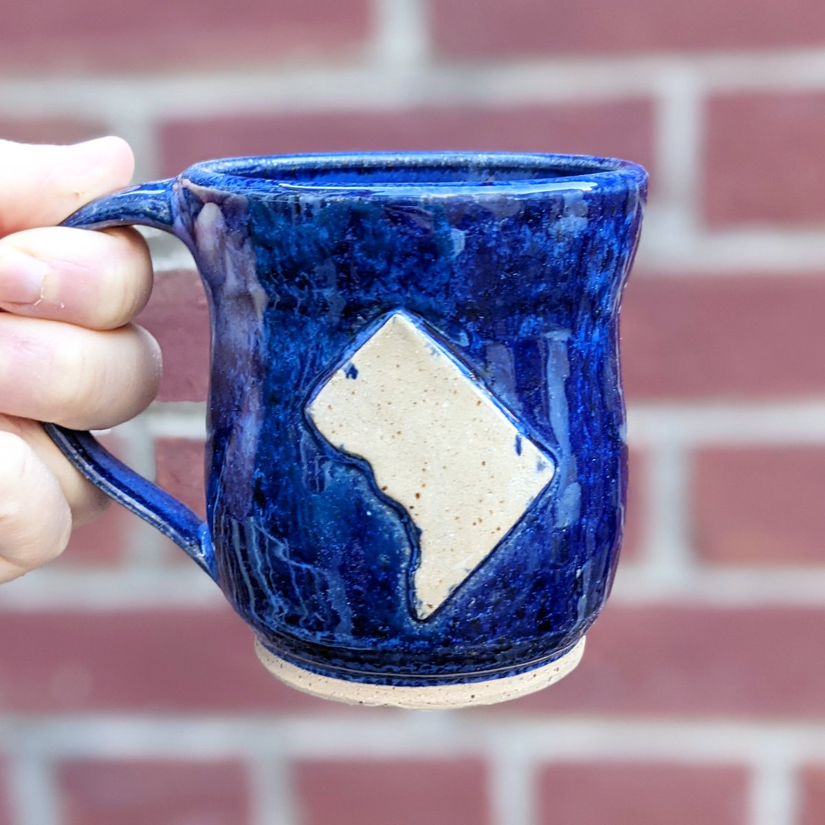 claylacepottery's tweet photo. I forgot this month was March Mug Madness! Here's one of my most recent #DCmap #mugs, which I'm getting ready to send out across the city.
#MarchMugMadness #bluemug #blueglaze #DCstatehood #mug #coffeemug #morningcoffee #caffeinefix #acreativedc #mydccool #madeindc #handmade https://t.co/wWU2ho8VkS
