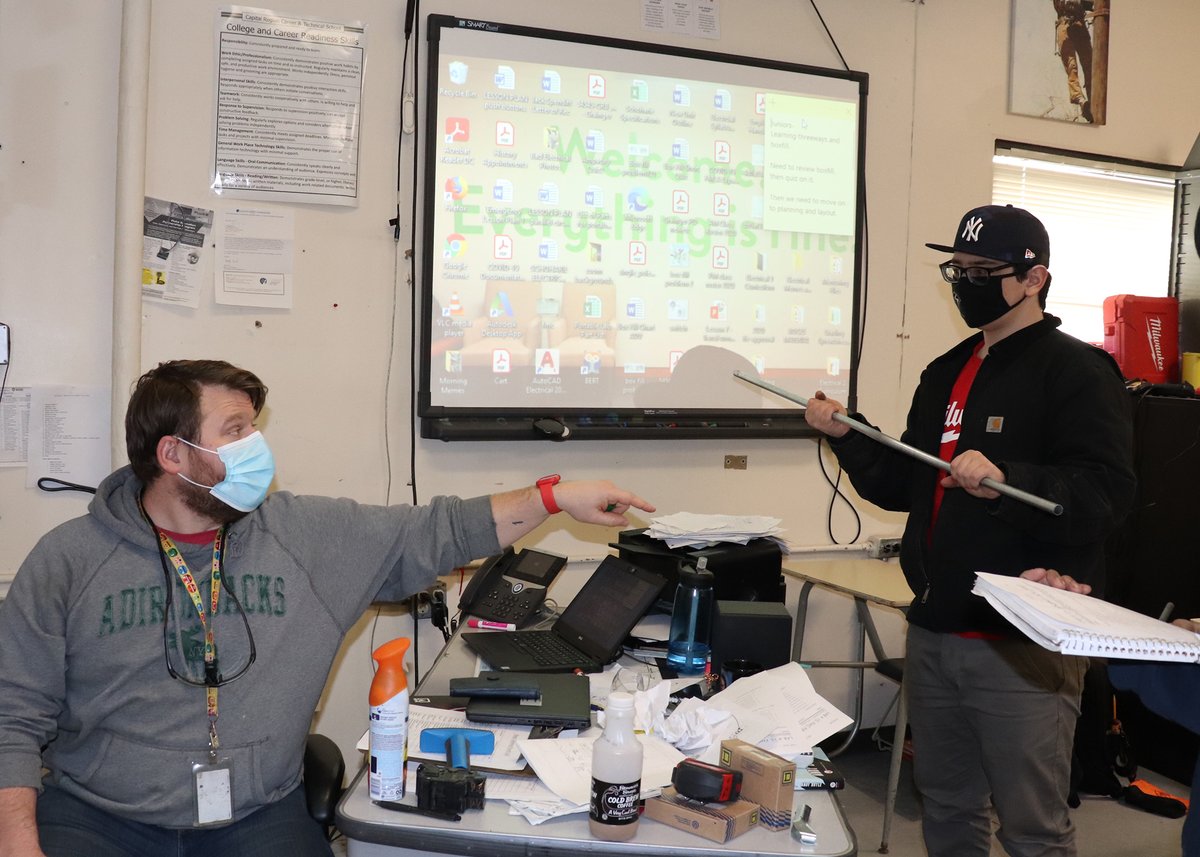 Jack Spendiff of @CohoesSchools and @CapRegionBOCES Electrical Trades Teacher Travis Relyea talk angles and measurements during a recent class in which Hack was bending metal conduit. #Teacher @actecareertech @NYSEDNews @nyschoolboards @BOCESofNYS #CTE