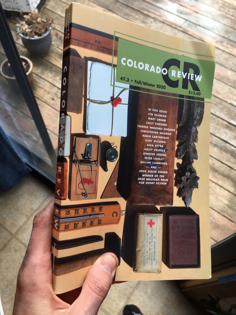 Love the awesome trompe l’oeil cover design for the new issue of <a href="/Colorado_Review/">Colorado Review</a>! (pardon the bike grease on my hand 🚲)
