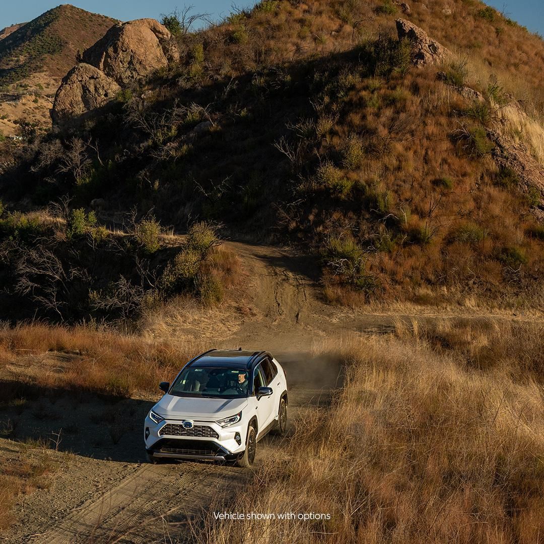 Loves the city. Lives for the outdoors. #RAV4 Hybrid #CarsonToyota