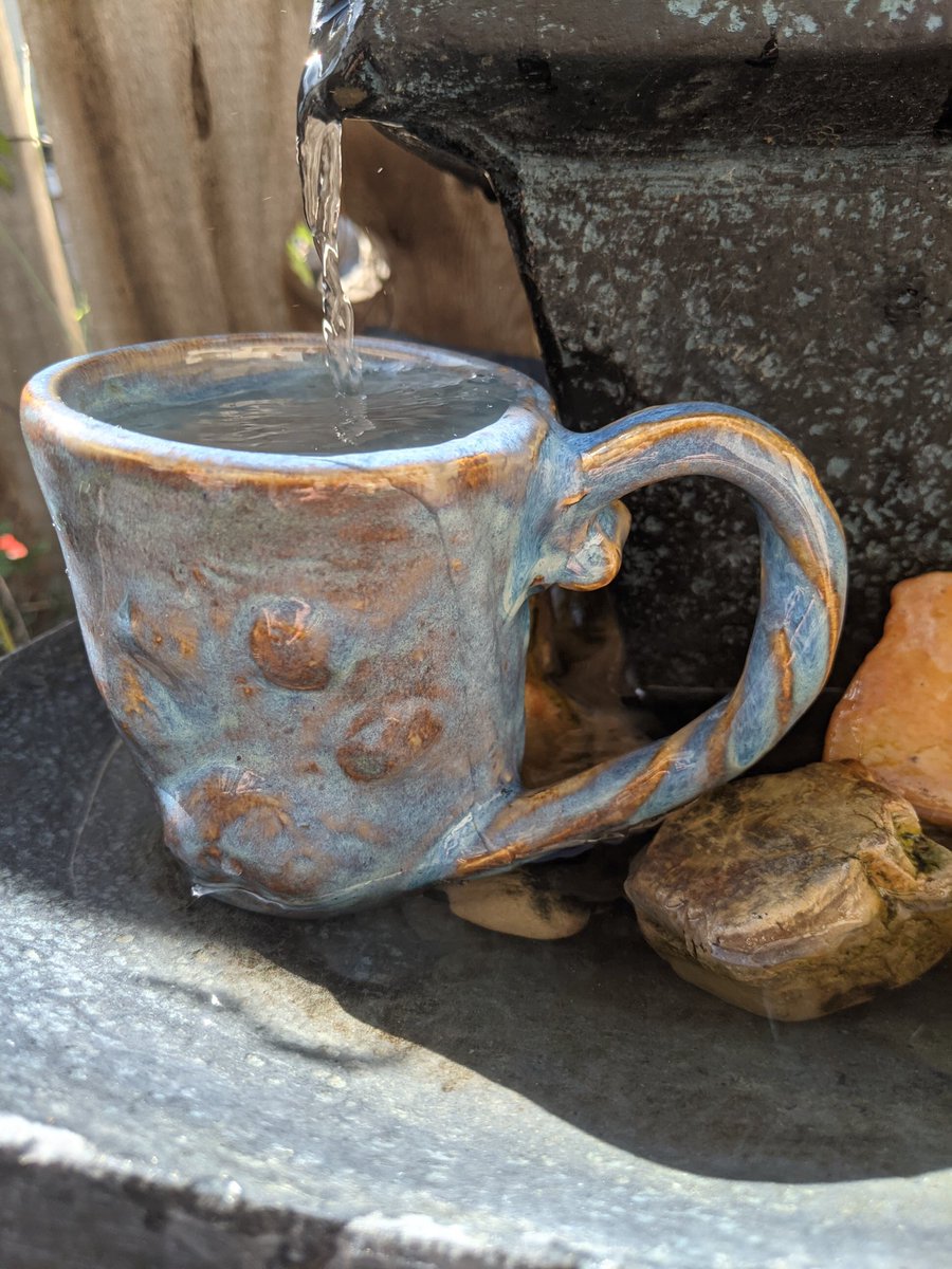 Pottery_lab's tweet photo. Just as the surf of the ocean leaves its wavy impressions in the sand, I like to capture the movement of clay in my hands with free-flowing curves, whirls and dimples. Find these whimsical creations at https://t.co/naQQyrwiqx #MeetTheMaker #CeramicArt #handmade #DisabilityArt https://t.co/ps3Ky6GonW