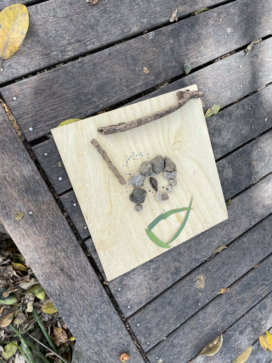 Exploring nature and building our <a href="/Dingoes_CPS2021/">@Dingoes_CPS2021</a>  buddy’s name with what we find. #reggio #natureplay