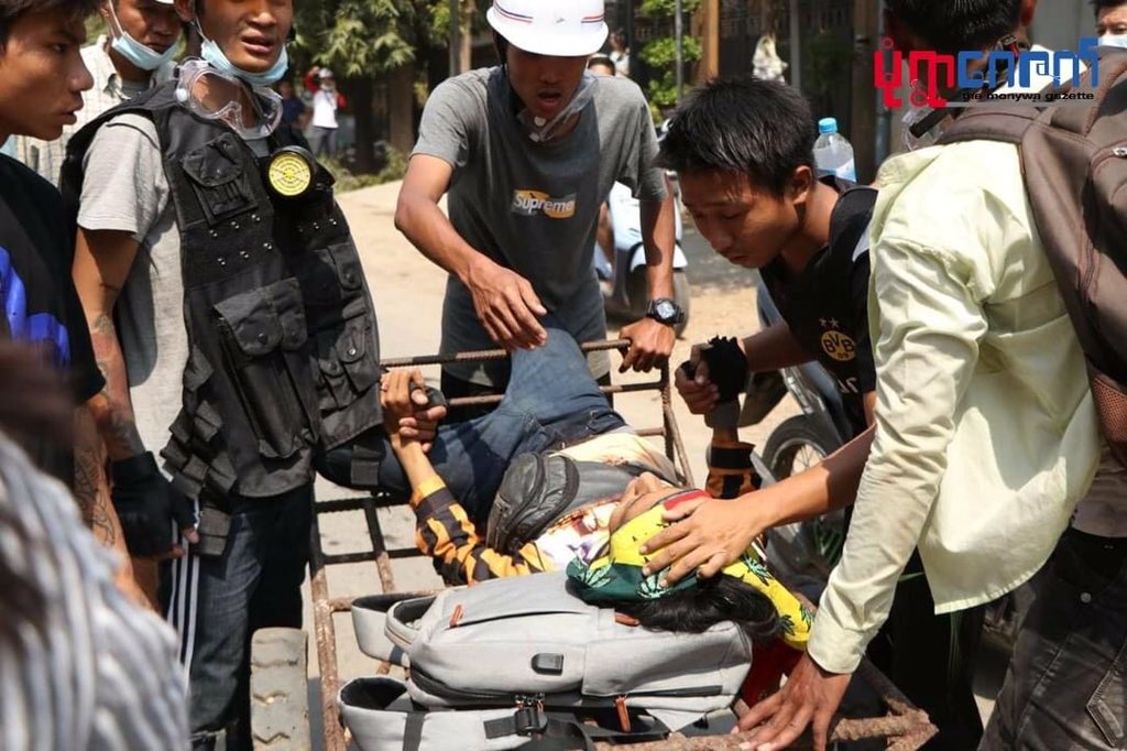 ThawMama's tweet photo. TW // blood,violence. Another headshot in Monywa. The girl is in serious condition. Many other civilians also got injuries. Why don’t we have the rights to protest peacefully?source: Monywa Gazette news @freya_cole #WhatsHappeninglnMyanmar #Mar3Coup https://t.co/X3MTme1ZSB