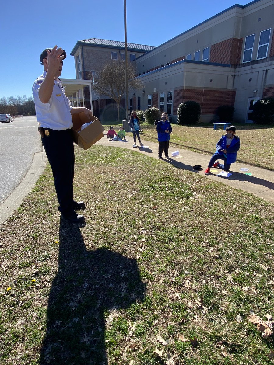 TheHawksNestSC's tweet photo. #theHawksNestSC had math outside today as we practiced adding multiples of 10. We even had a surprise visit from the Fire Marshall, who gave us a fire safety quiz. We PASSED and were rewarded with these cool hats! #MonaviewMoments #StillInTheGame https://t.co/v52CVEluSv