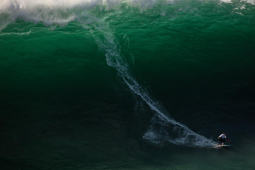 SurfGirlMag's tweet photo. An historic moment in surfing as Michelle des Bouillons is the first woman to surf the Azores "big wave". Read more about Michelle's awesome surf session here https://t.co/3yZjhZo1DO https://t.co/F7fE0zYacA