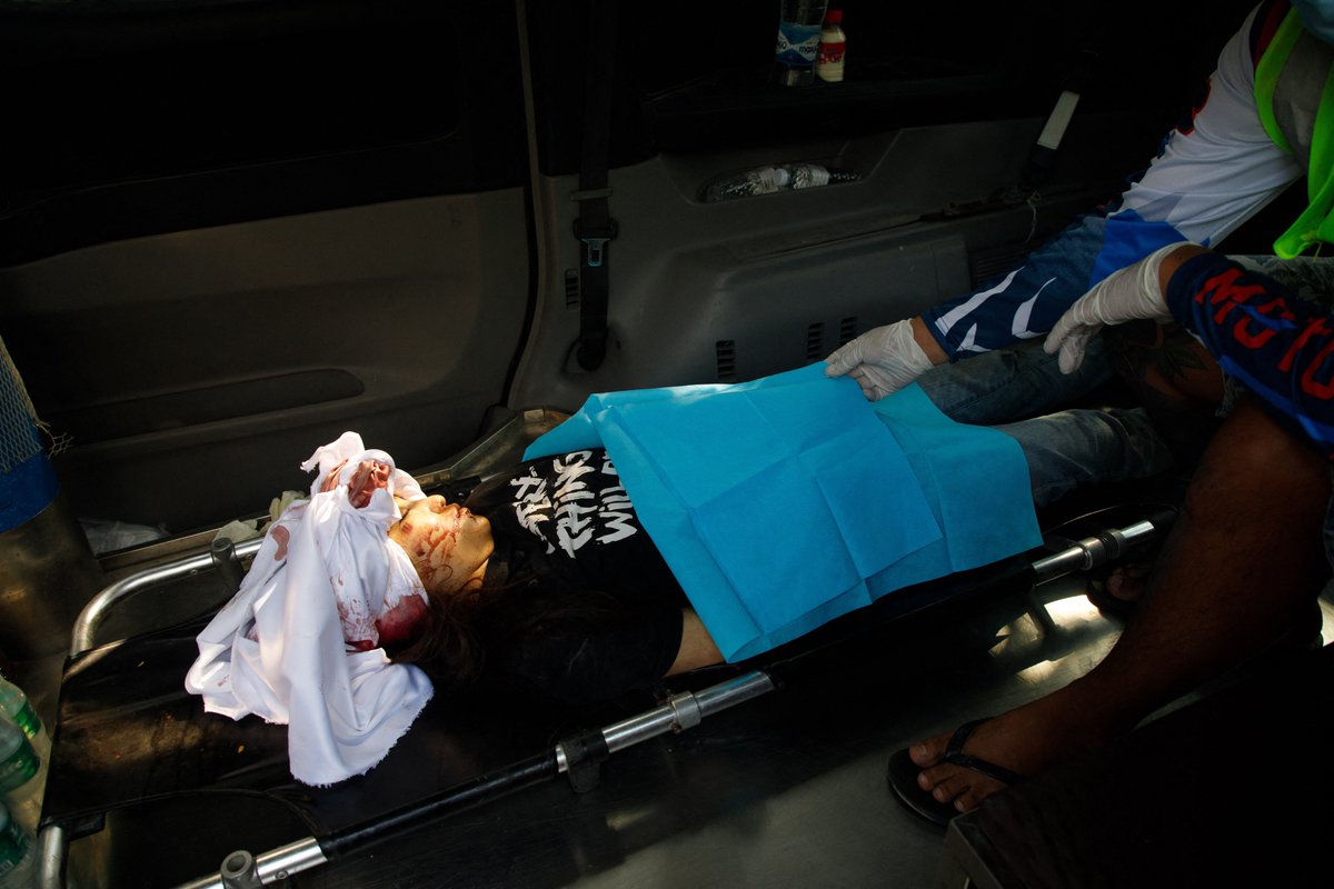 The body of Kyal Sin, also known by her Chinese name Deng Jia Xi, lays in an ambulance after being shot in the head during a demonstration against the military coup in Mandalay on March 3, 2021. Photo: AFP