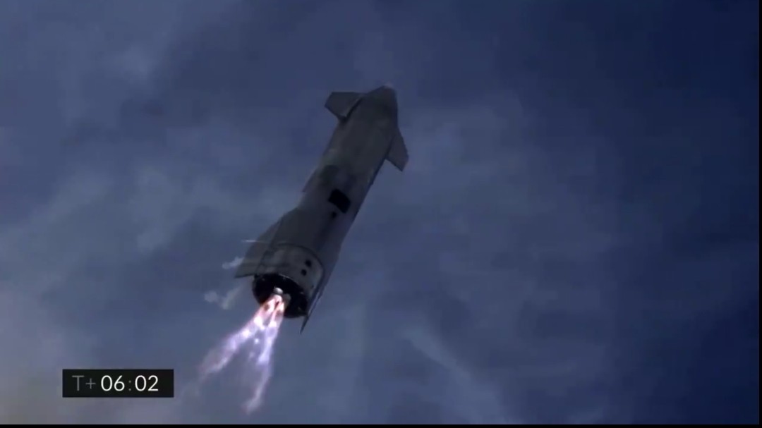 RobMcLav's tweet photo. Not a scene from a sci-fi movie, but a still from today's Starship test flight, and they stuck the landing! #Starship  #SpaceX https://t.co/82aNvw27S3