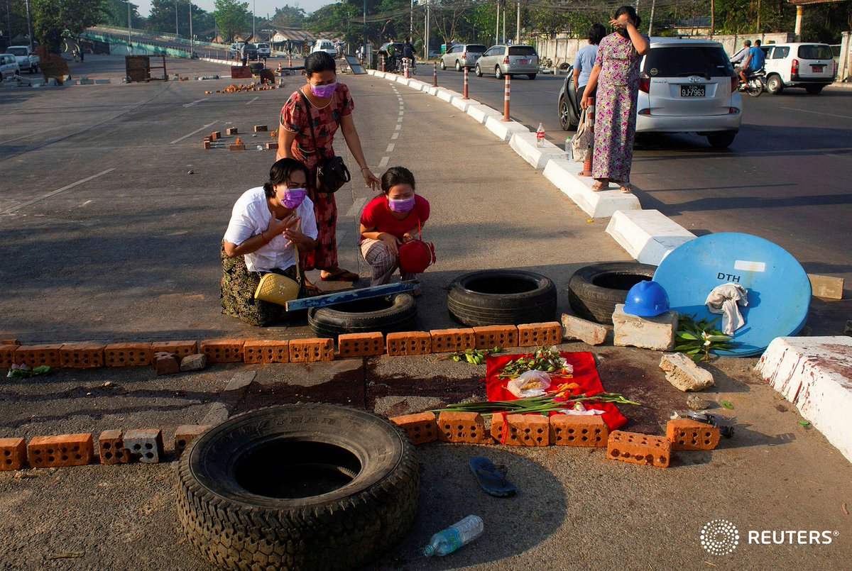 Family members cry near a spot with a protester was killed during a protest against the military coup in Yangon, Myanmar March 4, 2021. REUTERS #WhatsHappeningInMyanmar