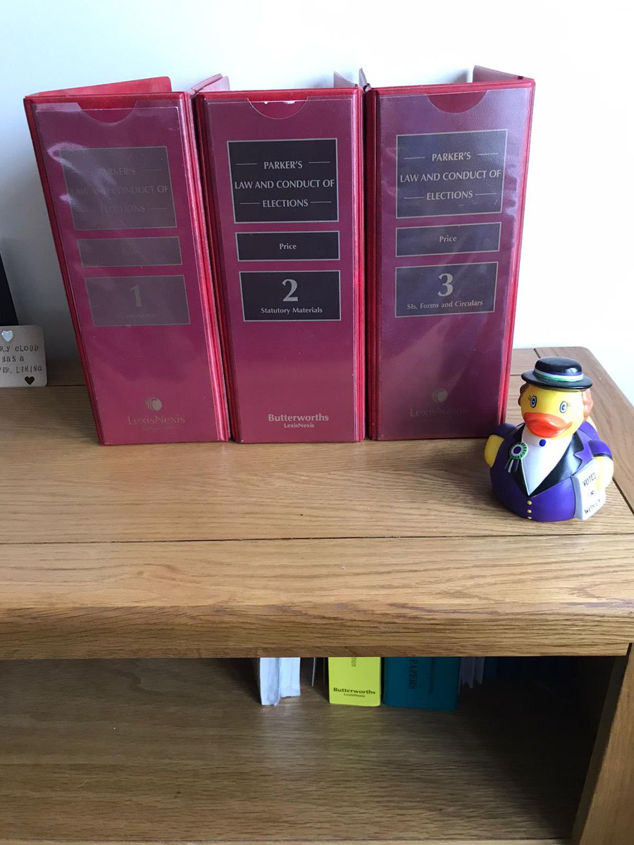AEA_Elections's tweet photo. Happy #WorldBookDay everyone! We love a classic here, so our favourite books have to be Parker’s Law and Conduct of Elections and Schofield’s Election Law, modelled here by @AEA_ChiefExec Peter Stanyon’s shelves and @AEA_DeputyCE Laura Lock’s @UKParliament #Suffraduck 📚 https://t.co/QrUD4cMasS