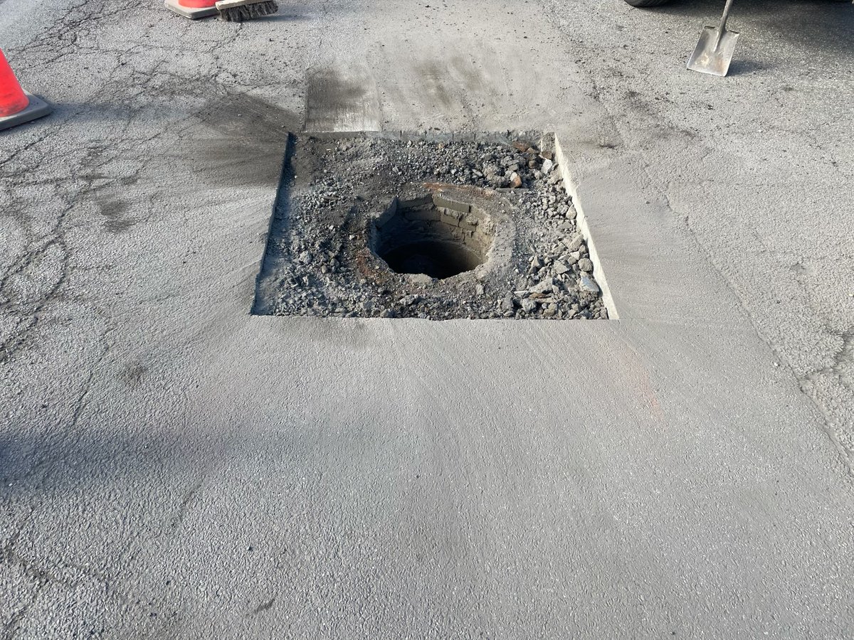 ALLOUTSealcoat's tweet photo. This Staten Island maintenance hole cover was damaged during the recent winter storm, creating a parking lot liability needing immediate attention. Rest assured knowing that when a safety issue arises, ALL OUT is available to respond 24/7. https://t.co/LDbSPvbeP6