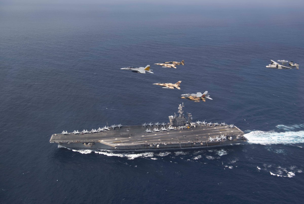 #RMAF s #F16 & #F5 , fly over the Nimitz-class aircraft carrier USS Dwight D. Eisenhower @TheCVN69 s  with Carrier Air Wing #CVW3