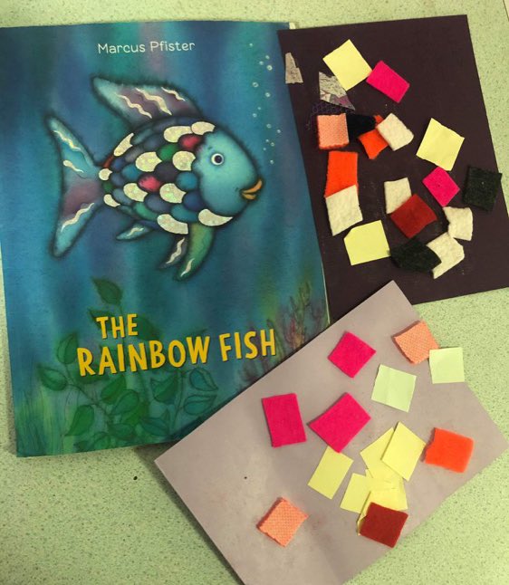 #worldbookday2021 We have been exploring our core books in our activities. The children used their cutting skills to cut out different shapes with different fabrics and textures to create our very own rainbow fish! Child’s voice 
‘My fish is big! That rainbow fish small.’