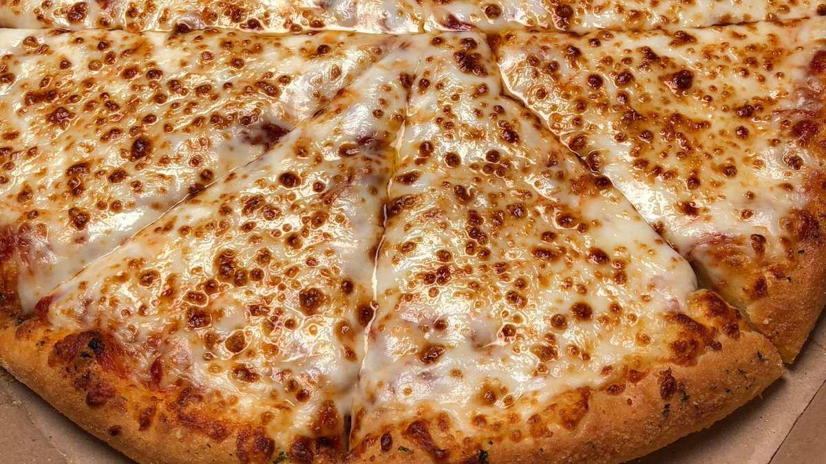 A close-up shot of cheese pizza. 