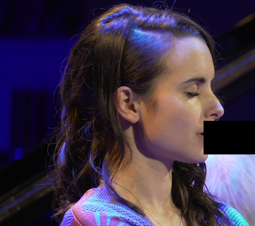 She's practicing her...technique.

Ignore the censor, it's just a trumpet.